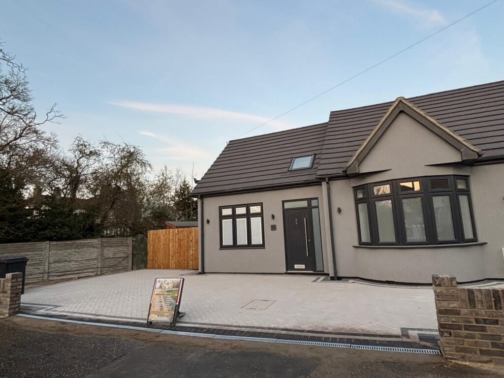Modern bungalow with completed block paved driveway and retaining wall – Essex driveway project