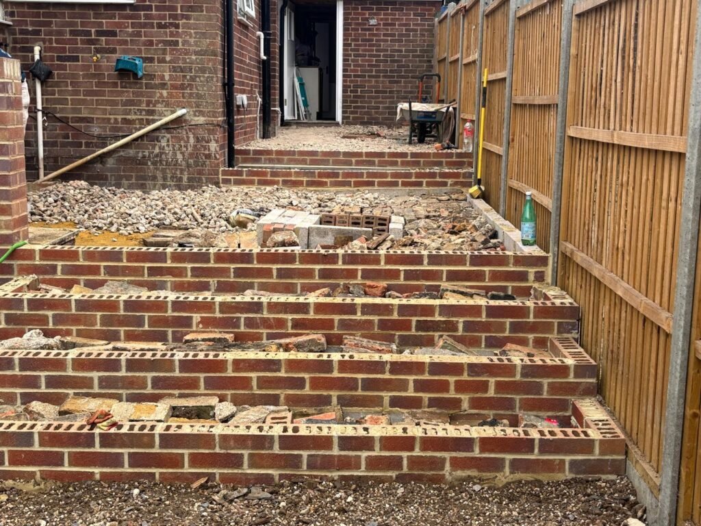 Completed multi-step brick staircase in back garden – professional landscaping in Essex